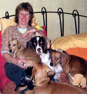 Martha with Trixibelle, Roxy, Phoebe, Joby and Queenie (dogs) plus Georgia (bird)